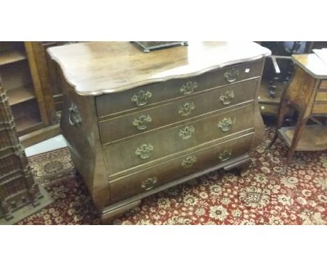 19th Century Dutch mahogany bombe commode, the shaped moulded top above four graduated drawers with brass handles and escutch