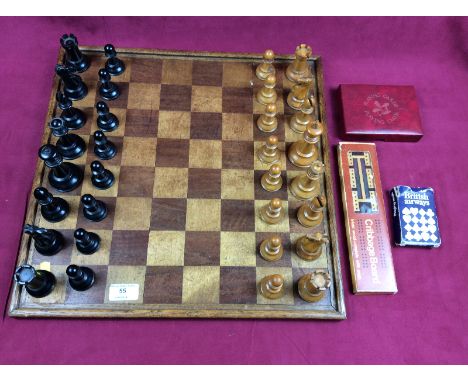 A Staunton patterned chess set (weighted) together with a chess board, a cribbage board, and playing cards 