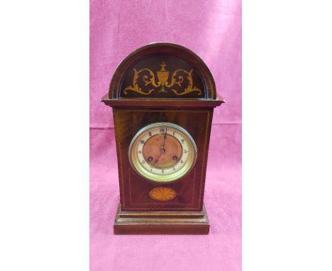 An Edwardian mahogany and inlaid two hole mantel clock 