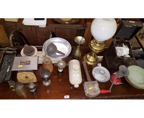 A brass oil lamp; a set of kitchen scales and weights; a stoneware hot water bottle; a wooden mallet; a soil testing outfit c