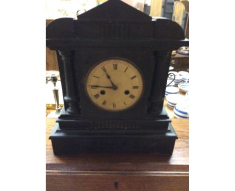 A late Victorian ebonised two hole mantel clock 