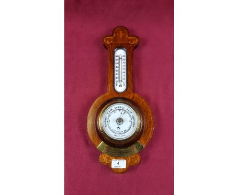 An early 20th Century mahogany and inlaid aneroid barometer with brass presentation plaque