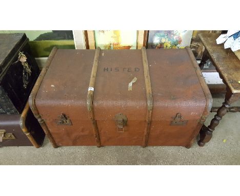 A canvas and wooden bound travelling trunk 