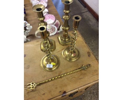 Two pairs of Victorian brass candlesticks; and a brass toasting fork 