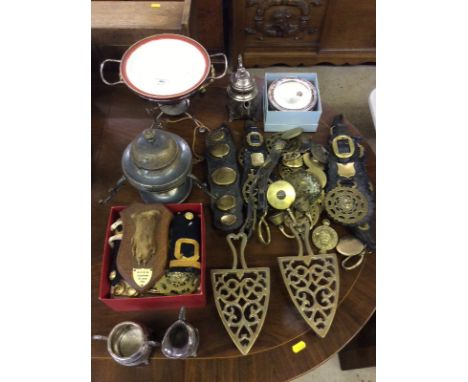 A quantity of various horse brasses; two trivet stands; hunting trophy; a silver plated three piece tea set, brass buttons et