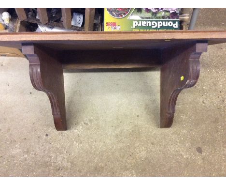 A mahogany wall shelf 