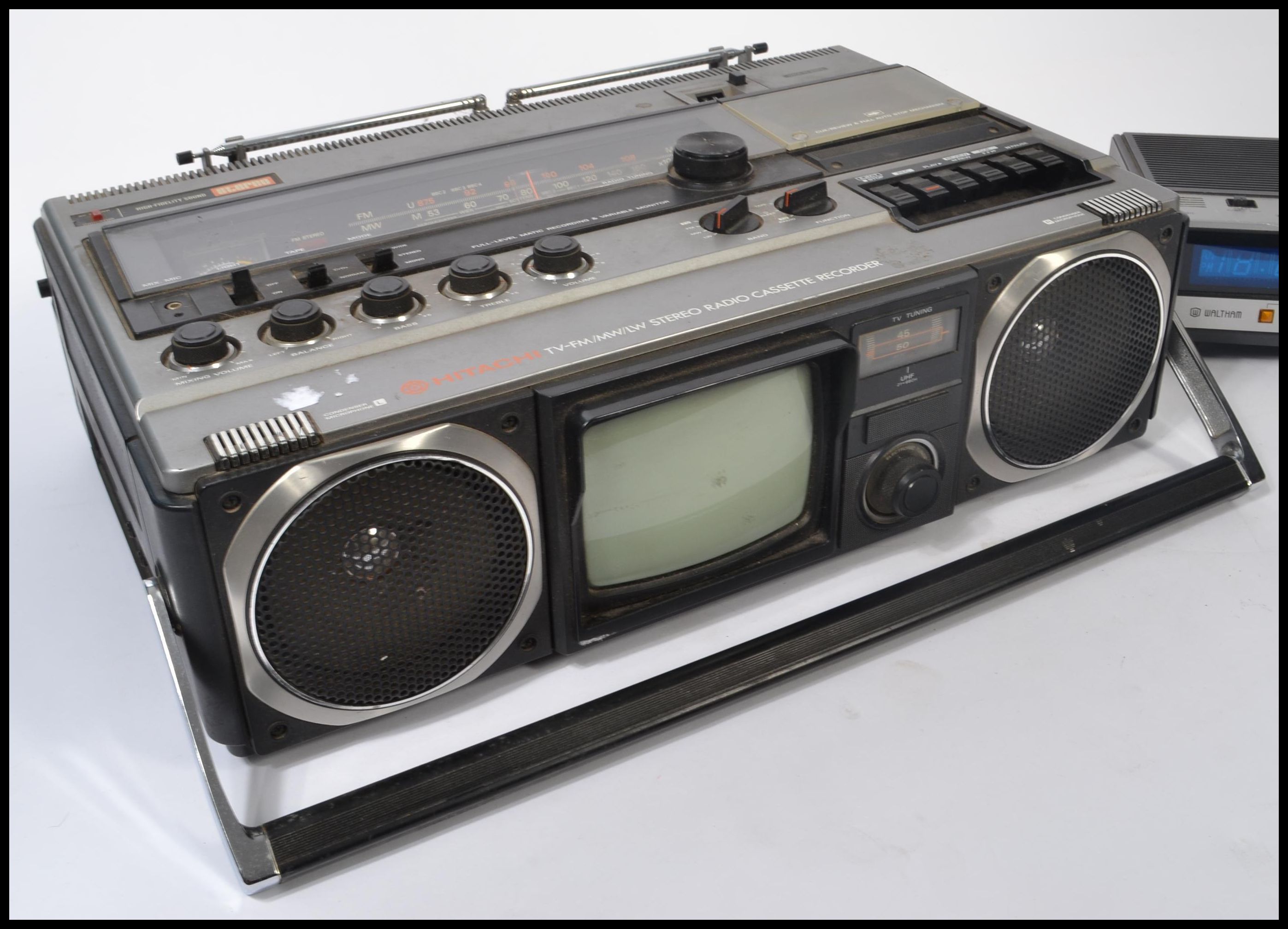 A Hitachi Tv Fm Mw Lw Stereo Radio Cassette Recorder Along With A