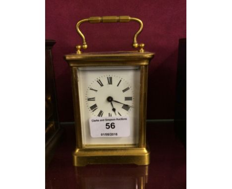 A brass cased carriage clock with key