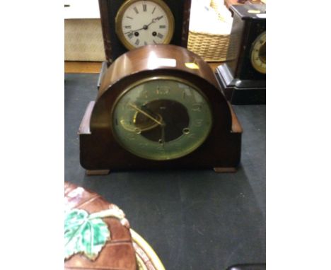 A Smith's walnut cased Westminster chime three hole mantel clock