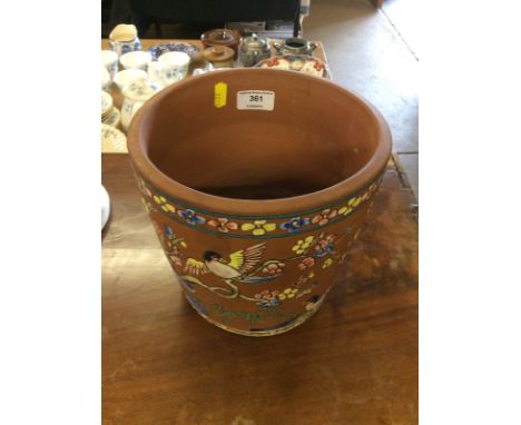 A terracotta Chinese jardinière with enamel decoration