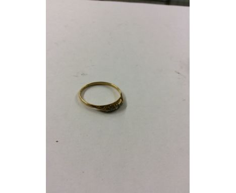 A yellow metal and diamond set ring (marks rubbed)