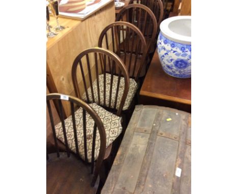 A set of six elm seated stick back kitchen chairs and two stick and wheel back kitchen chairs 