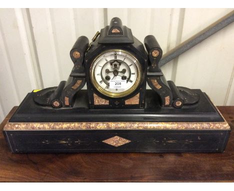 A late Victorian black slate and marble mantel clock with visible escapement 