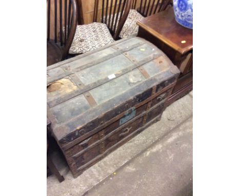A  large metal bound dome top trunk for restoration