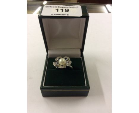 A 9ct white gold ring set with pearl, tanzanite and diamonds