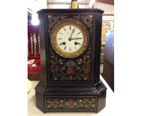 A late 19th Century French ebonised and brass inlaid two hole mantel clock