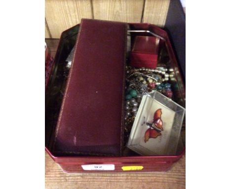 A tin of costume jewellery; a Dutch style plated ring box etc.