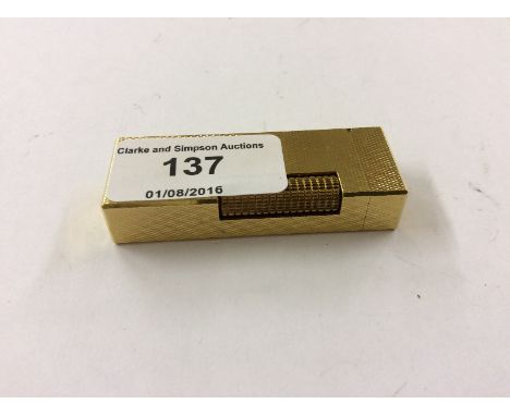 A Dunhill gold plated lighter with engine turned body