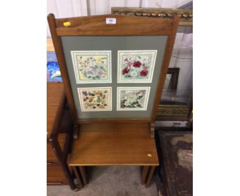 Two teak occasional tables and a firescreen inset with four embroideries