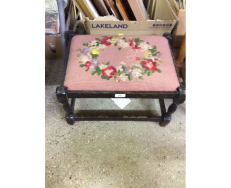 An oak stool with needlepoint upholstered seat