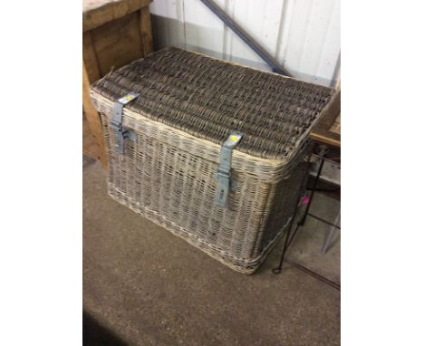 A large wicker laundry basket stamped 'G W R'