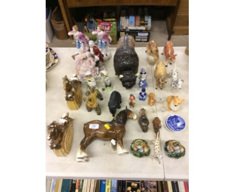 A Melba ware model of a buffalo; various Beswick animal ornaments; porcelain figurine groups etc. 