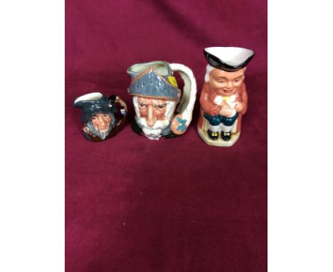 A Royal Doulton miniature jug 'Don Quixote'; another 'Rip van Winkle' and a pottery Toby jug