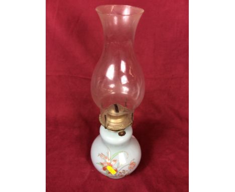 A Victorian oil lamp with painted opaque glass base