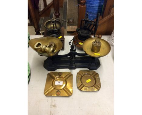 A set of brass kitchen scales and weights; a pair of brass Player's advertising ashtrays; another for Bass and two coffee gri
