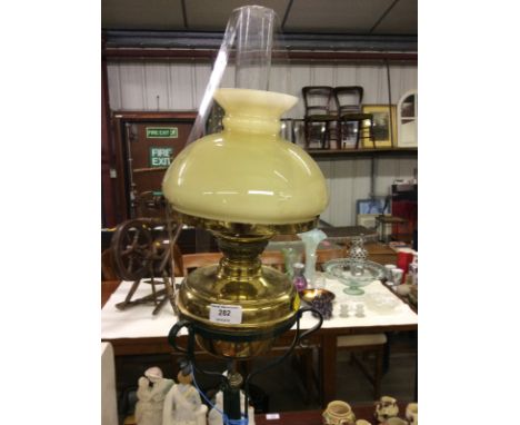 A wrought metal and brass adjustable oil lamp standard converted to electricity