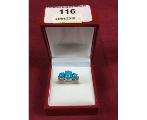 A sterling silver and turquoise set ring