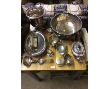 A quantity of silver plated ware top include half fluted champagne bucket; a punch bowl; a three piece teaset; ladle etc.