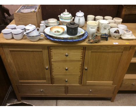 A light oak effect sideboard fitted five drawers 