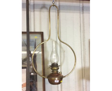 A late Victorian brass and copper hanging oil lamp