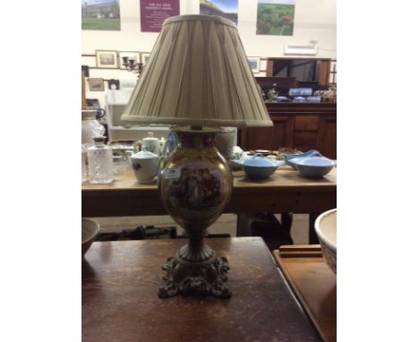 A Continental porcelain and gilt metal mounted table lamp and shade