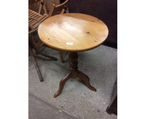 A modern pine tripod table