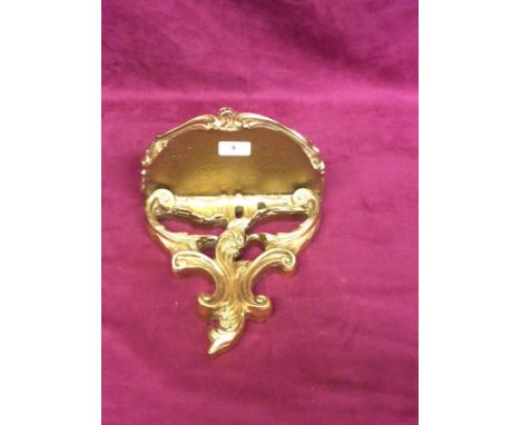 A modern gilded wooden wall bracket