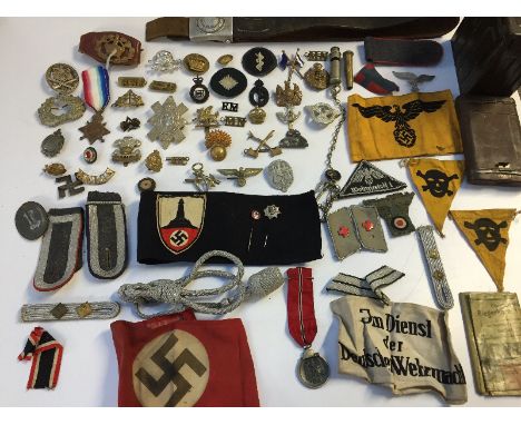 German militaria including:a Belt, map, gun cleaning kit, ammunition tin, armbands, epaulettes, medal ribbon, sword attachmen