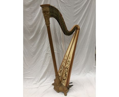 A satin birch and giltwood Grecian harp by J. A. Stumpff, with winged figures above a fluted stem, the brass frame stamped `P