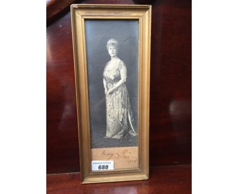 A full length black and white portrait photograph of Queen Mary signed and dated 1928 to the bottom, 24 x 7.5cm