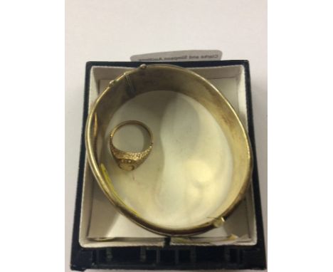 A 9ct gold cameo ring and a silver gilt bangle