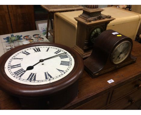 An oak three hole mantel clock; an early 20th Century two hole mantel clock and a mahogany cased wall clock