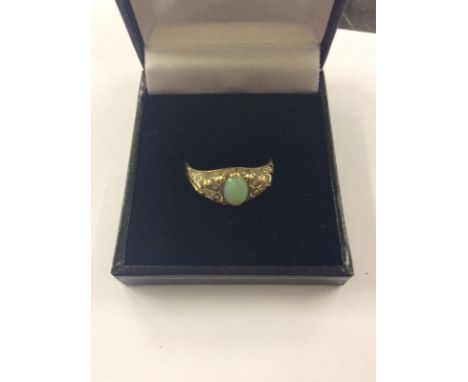 A 9ct gold opal set ring