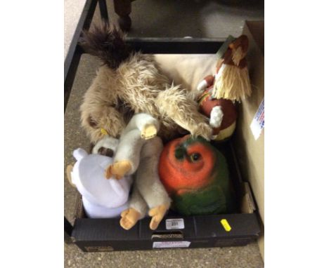 A box containing a Steiff monkey and various other stuffed toys etc.