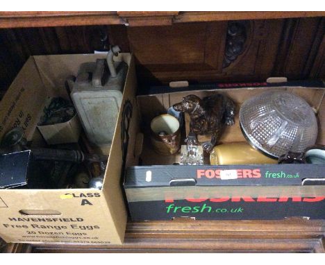 Two boxes containing a pottery model dog; a soda syphon; a brass lantern clock; various metalware etc.