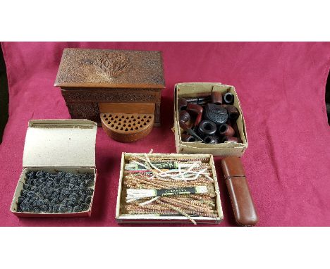 A carved wooden cigarette box; a box of various pipes; pipe cleaners; a leather cigar case etc.