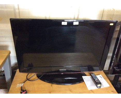 A Samsung flat screen television with remote control