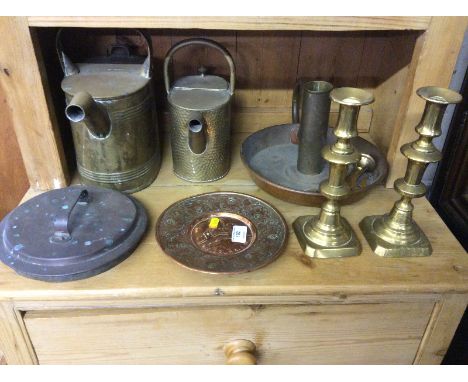 Two brass watering cans; a pair of brass candlesticks; a chamber stick etc.