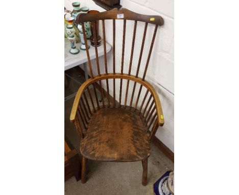 An elm and beech stick back elbow chair