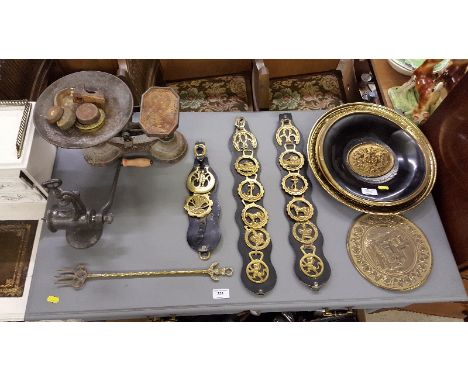 A set of cast iron scales and weights; a mincer; three horse brasses; embossed plaques etc.